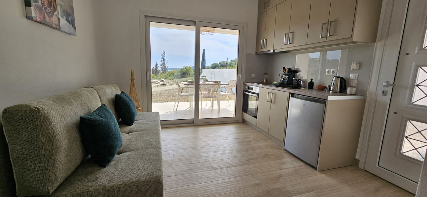 Arillas Peaceful Bungalows Corfu sofa and kitchen fourth house